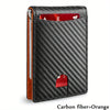 A black carbon fiber wallet with an orange accent, showing a red card slot.