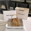 Gold crystal-embellished evening clutch with chain displayed in a white box.