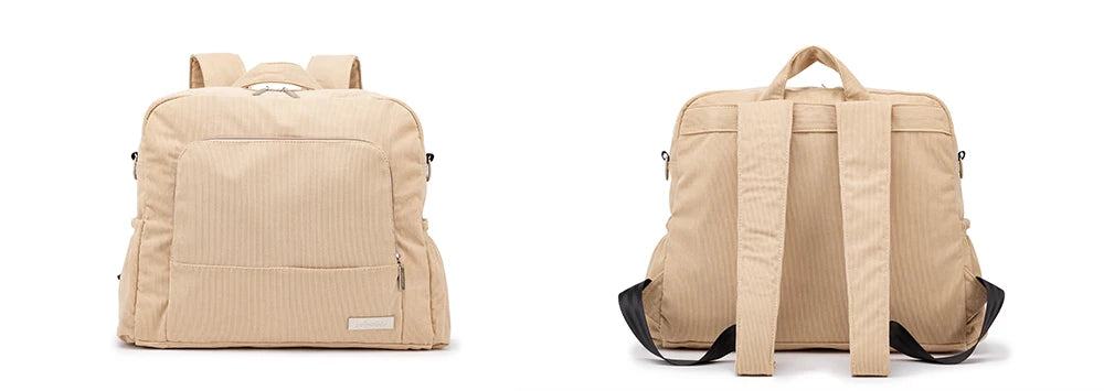 A beige soft corduroy diaper backpack shown from the back view.
