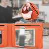 An orange leather wallet is shown open, displaying a credit card and a hand holding a card over the wallet.