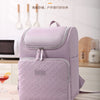 A purple insulated picnic cooler backpack is shown on a table with food items nearby.
