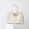 A cream-colored genuine leather women's shoulder tote bag with a light beige canvas handle.