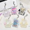 A set of clear acrylic photocard holders featuring angel wings and heart shapes, displayed on a white background.