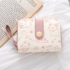 Helle rosa Kunstleder-Kleine Münztasche mit niedlichen Katzenillustrationen und pinkem Riemchen.