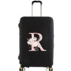 Black luggage protector cover with a large pink floral letter R design