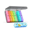 A clear weekly pill organizer with 7 compartments for daily medication, showing pink, yellow, green, and purple pills.