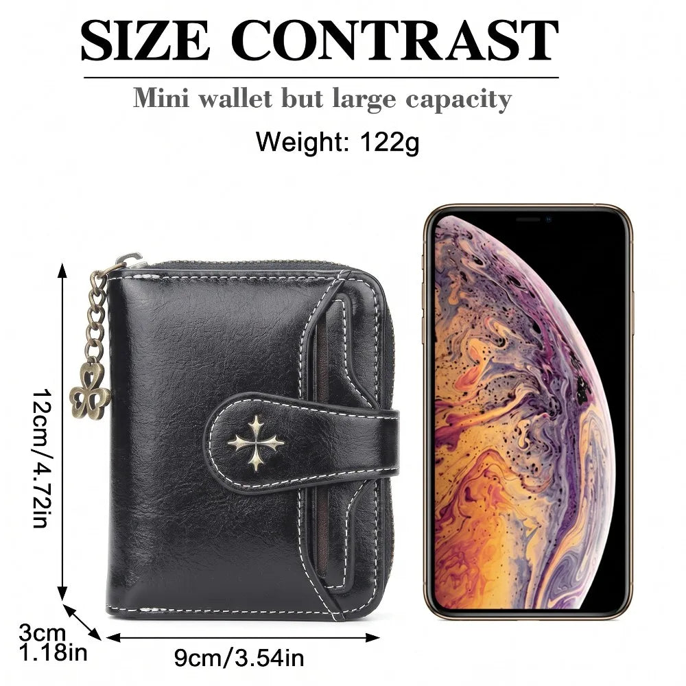 Black leather mini wallet with a clover charm shown next to an iPhone display.