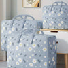 Light blue storage bags with a white floral pattern resting on a wooden surface.