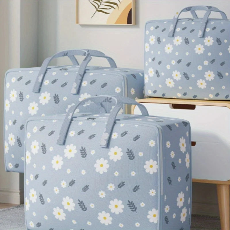Light blue storage bags with a white floral pattern resting on a wooden surface.