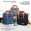 Three insulated double-deck lunch bags in blue, gray, and black with orange straps shown on a white background.
