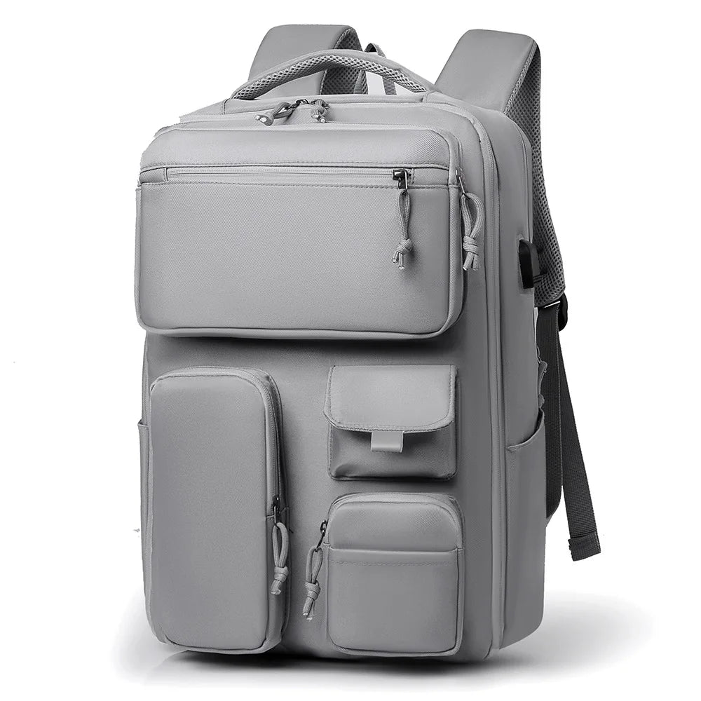 A gray unisex large capacity travel backpack shown from the front.