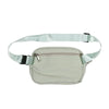 A light mint green waist bag or fanny pack with a strap and zipper.