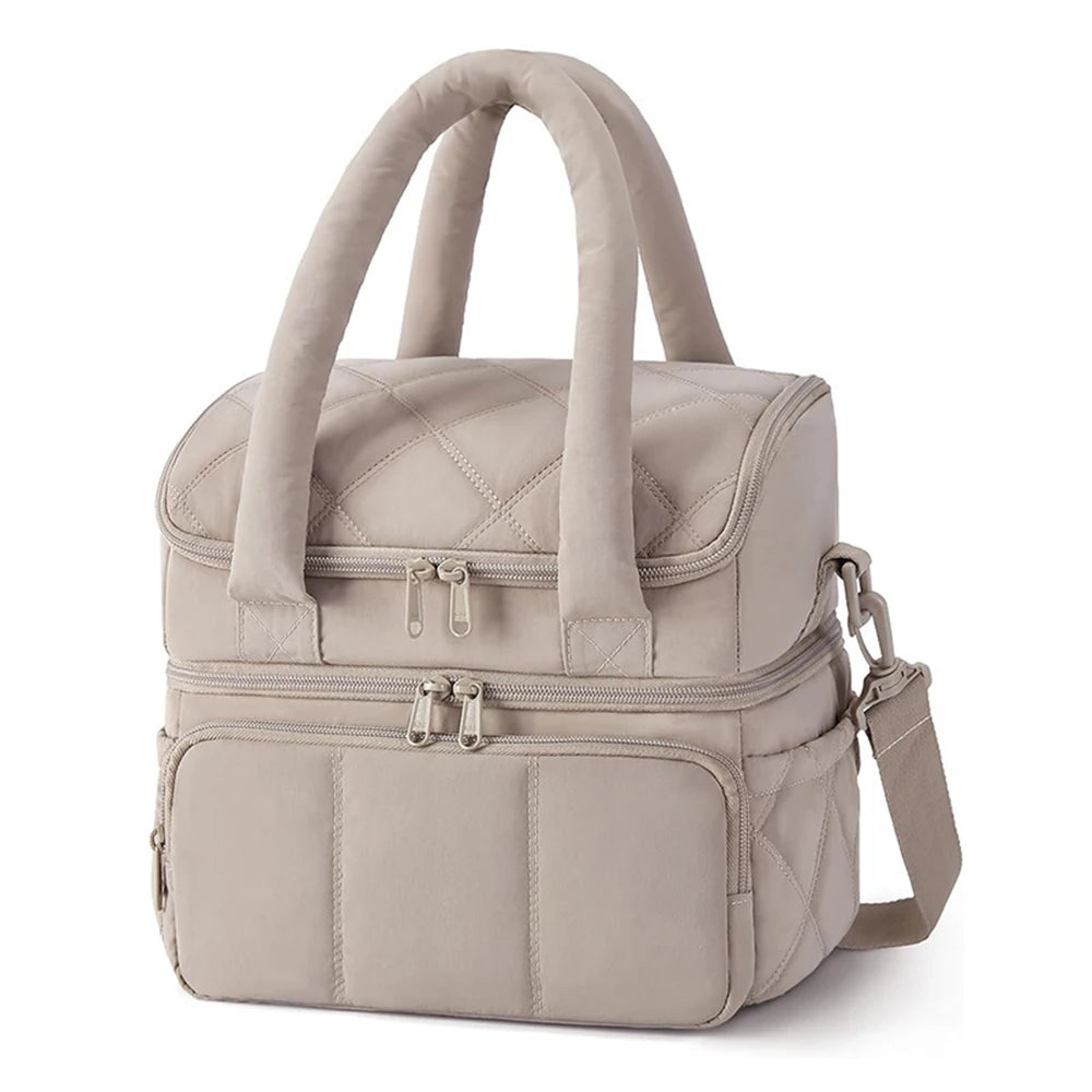 A beige quilted insulated lunch bag with carrying handles and zippered compartments.