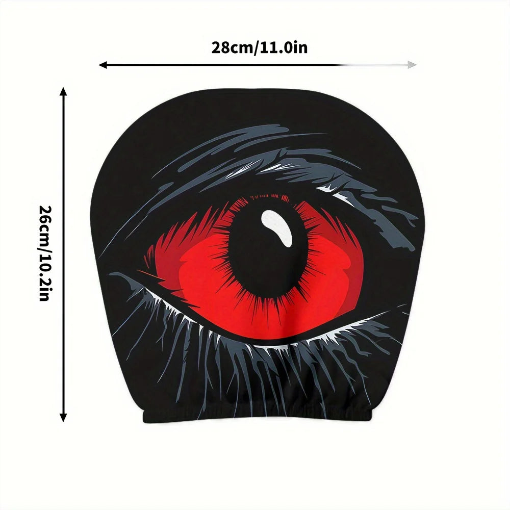 A pair of black car headrest covers featuring a realistic red and black eye design.