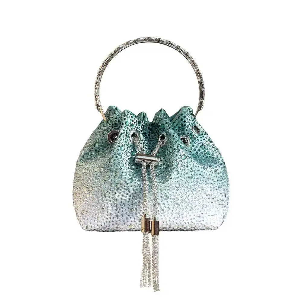 A shimmering teal crystal-embellished evening clutch with a silver chain strap.