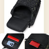 A tactical multi-pocket sling bag in black camouflage fabric with a red accent.