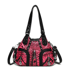 A pink leopard print PU leather tote bag with a black adjustable strap.