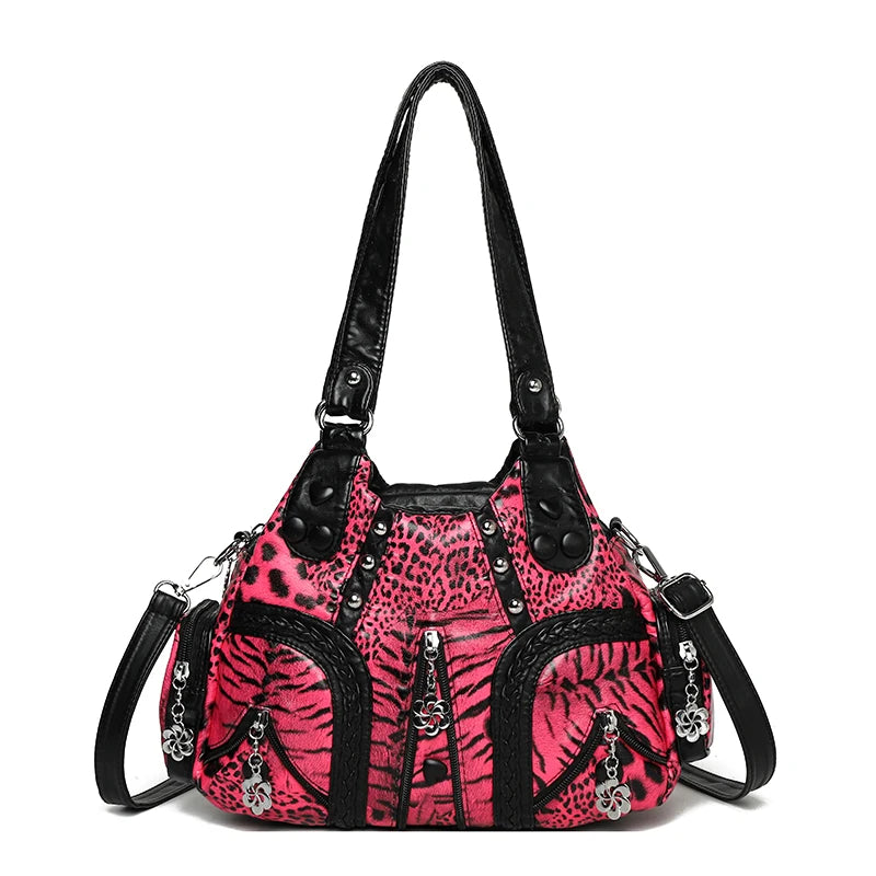 A pink leopard print PU leather tote bag with a black adjustable strap.