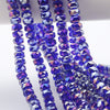 Strands of iridescent blue purple AB faceted crystal glass beads in a wheel shape for jewelry making