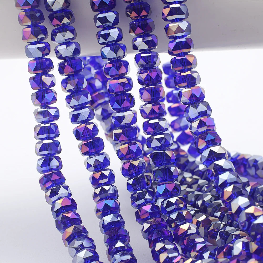 Strands of iridescent blue purple AB faceted crystal glass beads in a wheel shape for jewelry making