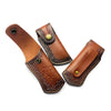 A brown leather knife sheath with a belt loop and decorative stitching is shown from an angled view.
