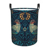 A dark blue floral patterned laundry hamper with black handles.