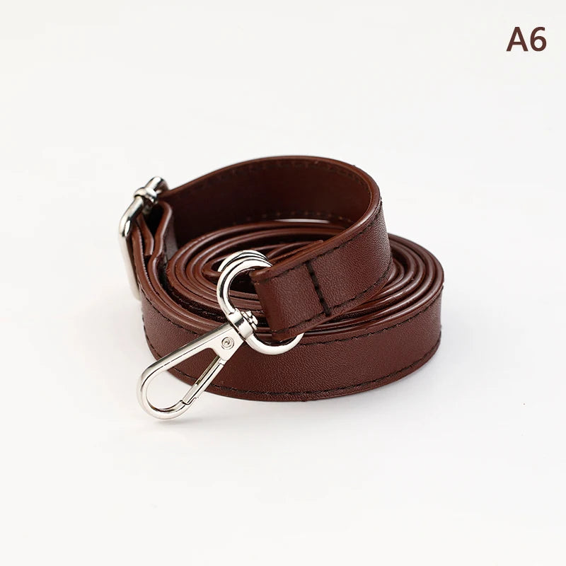 A brown PU leather strap coiled and displayed, featuring a silver metal clasp.