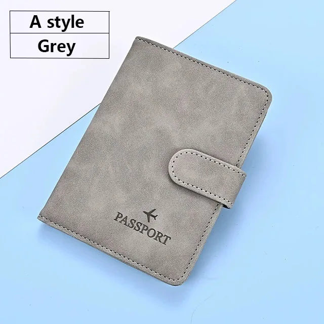 A grey premium PU leather passport and ID holder cover with a flap closure.
