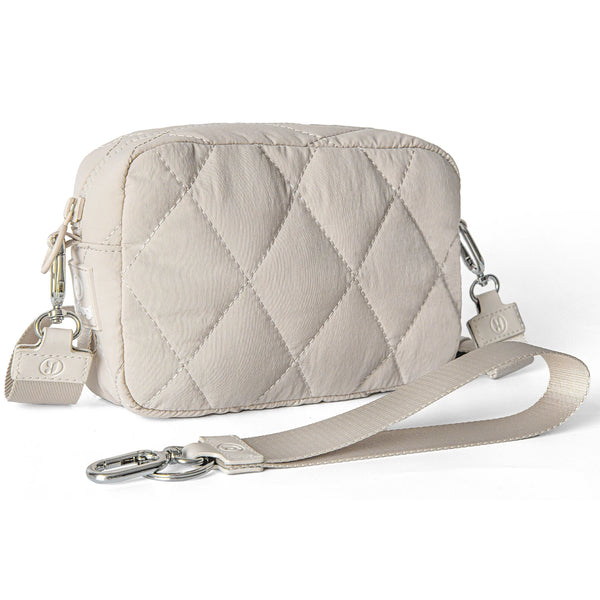 A light beige quilted nylon wristlet wallet with a silver hardware strap.