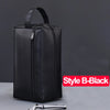 Black waterproof PU leather travel toiletry bag with a zipper shown against a gray background.