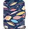 A dark blue suitcase with a patterned protective cover featuring stylized fish and leaves.