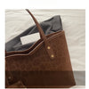 A close-up of a brown leopard print tote bag resting on a light-colored surface.