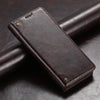 A dark brown magnetic leather flip case with a card holder resting on a dark surface.