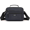 A dark blue Aotian compact waterproof crossbody messenger bag with black strap.