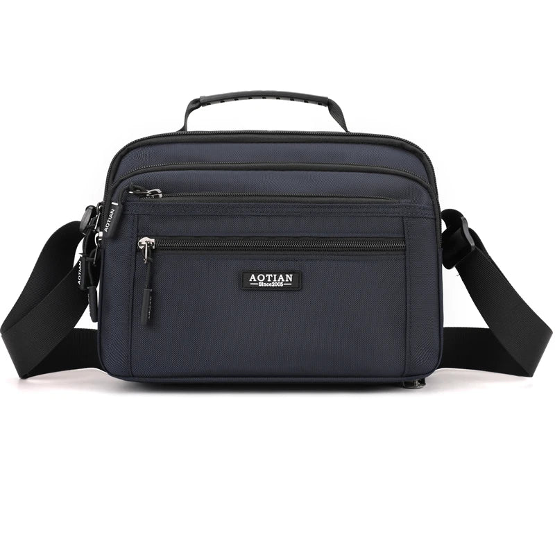 A dark blue Aotian compact waterproof crossbody messenger bag with black strap.