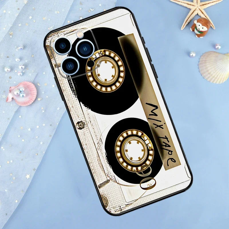 A phone case featuring a vintage cassette tape design with gold and black accents on a light blue background.