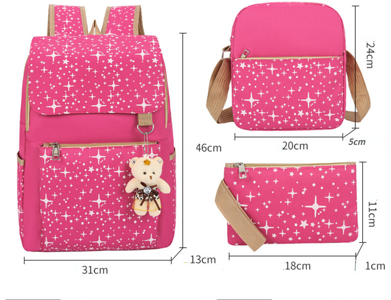 A bright pink canvas student backpack with a repeating white star pattern and a teddy bear charm.