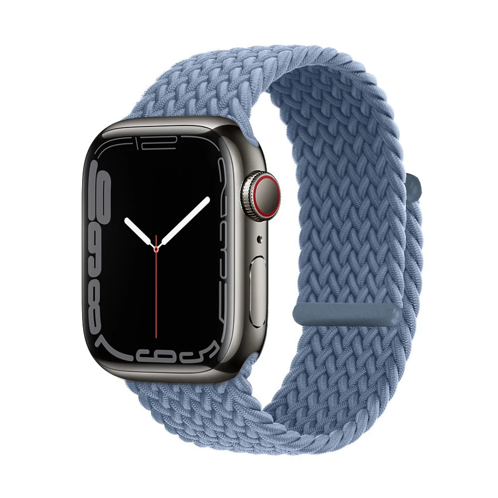 A dark gray Apple Watch is shown attached to a light blue braided stretch band.