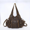 A brown vintage PU leather hobo shoulder bag with leather straps and hardware.