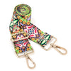A colorful, patterned nylon crossbody bag strap with gold-toned hardware.
