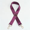 A purple nylon adjustable shoulder strap with gold-toned hardware.