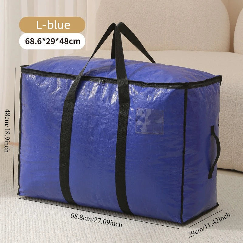 A blue woven storage bag with black handles and double zippers shown next to a sofa.
