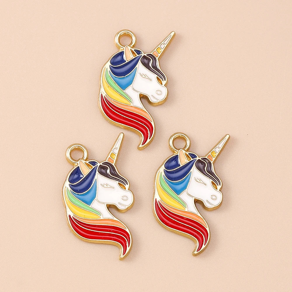 Two gold-plated unicorn horse charm pendants featuring rainbow stripes on a white background.