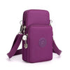 A purple compact nylon crossbody phone bag with a silver chain and adjustable strap.