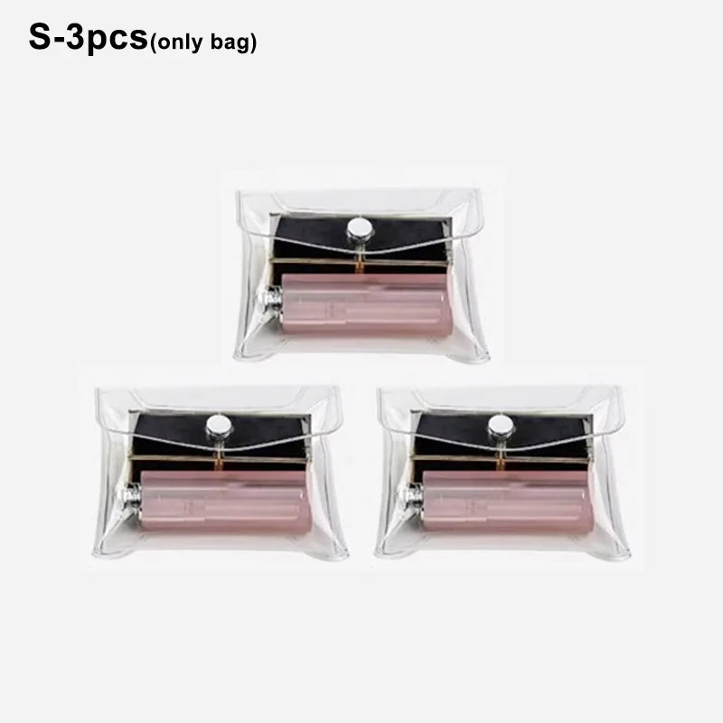 Three clear plastic bags containing cosmetic items or tools for portable organization