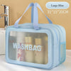 A light blue double-layer clear wash bag with a strap, shown next to a faucet.