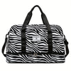 A black and white zebra print nylon travel duffle bag with black handles.