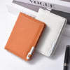 A slim vertical men's card wallet in orange and off-white colors resting on a white surface.