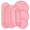A set of pink oval PU leather bag bases with pre-punched holes for crochet and knitting projects.