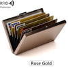 A Rose Gold stainless steel card holder displaying various credit cards and an RFID protection label.